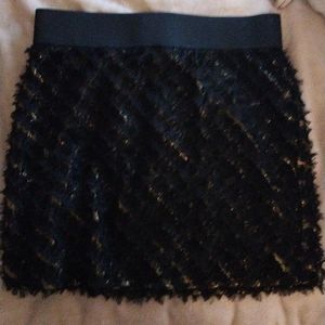 Frilly black and gold sparkly mini skirt from Guess